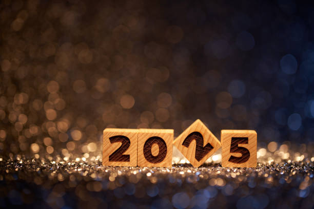 istock Wooden blocks forming 2025 against a sparkling backdrop with defocused festive lights in the background 2170348549