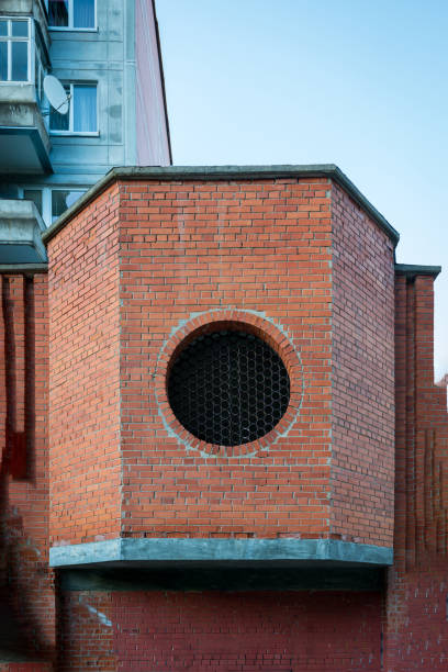 Round circle window on old and weathered brick wall - concept image with copy space.