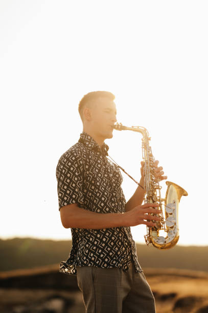 istock A talented saxophonist captivates the audience with a mesmerizing, soulful performance during a breathtaking sunset 2170351315