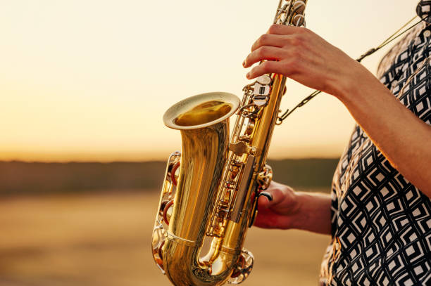 istock A talented musician plays the saxophone at sunset, expressing creativity in a serene and inspiring setting 2170351412
