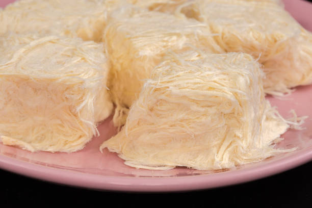 istock Traditional Turkish sweets pishmanie on pink dish on black background 2170354176
