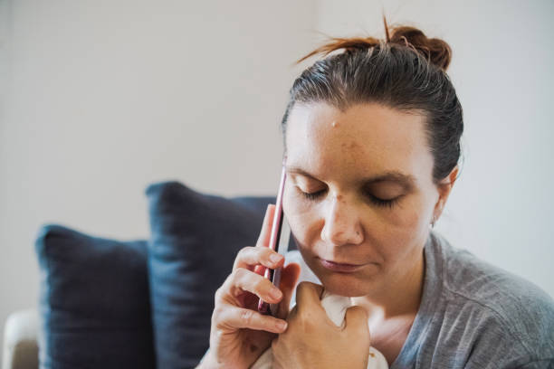 istock Calling my doctor for advice on broken nose 2170354539
