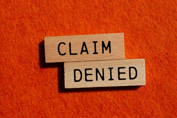 istock Claim denied message written on wooden blocks with orange background 2170355233