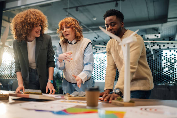 istock Interracial staff collaborating on renewable energy resources at office 2170356959