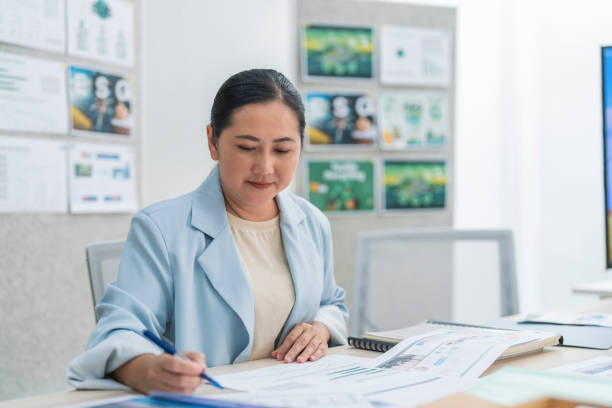 istock Ideas sharing for Business success. Business Development Teamwork start new project status meeting or decision to report  ESG (environment,social,governance) for sdgs goals in a sustainable green office working discussion 2170358394