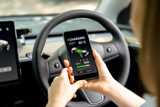 istock Young woman inside the vehicle, checking EV vehicle's application. Exalt 2170359935