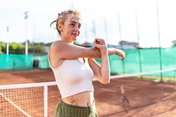 istock Cheerful tennis player stretching 2170364316