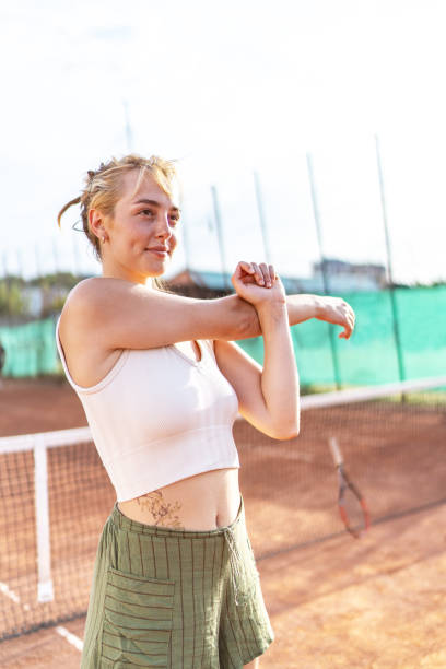 istock Cheerful tennis player stretching 2170364332