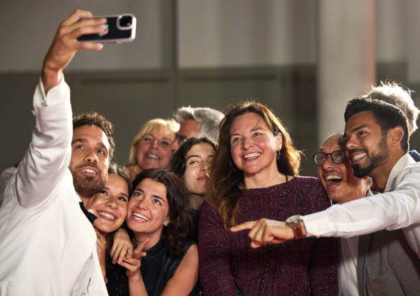 istock Happy celebrities taking selfie at premier 2170367283