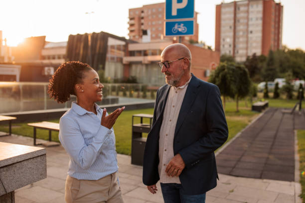 istock Two people talking business outdoors in a business area 2170367587
