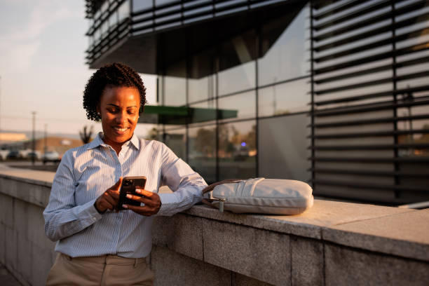 istock Happy black businesswoman using phone 2170367881