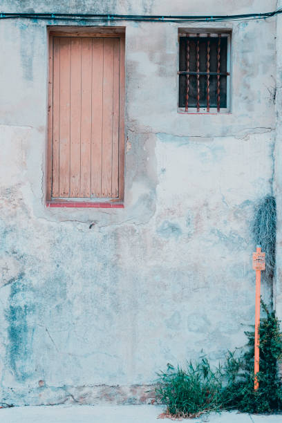 istock Exterior Concrete Wall Facade With Door High Up 2170368958