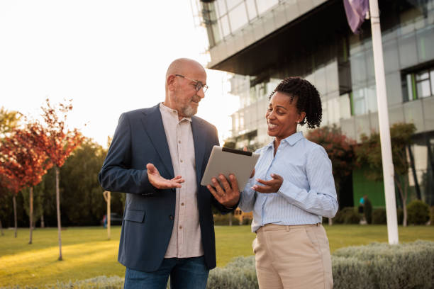 istock Two people doing business outdoors in a business area 2170369301