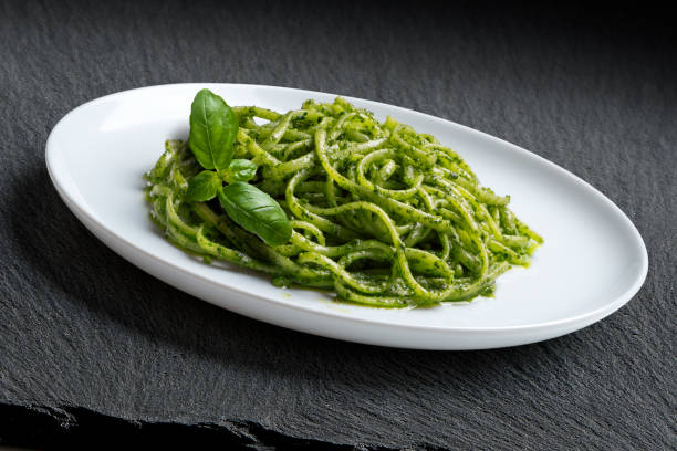 istock Dish with linguine with Genoese pesto sauce and basil leaves 2170371759