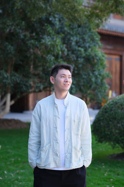 istock smiling Chinese young man looking away 2170371913