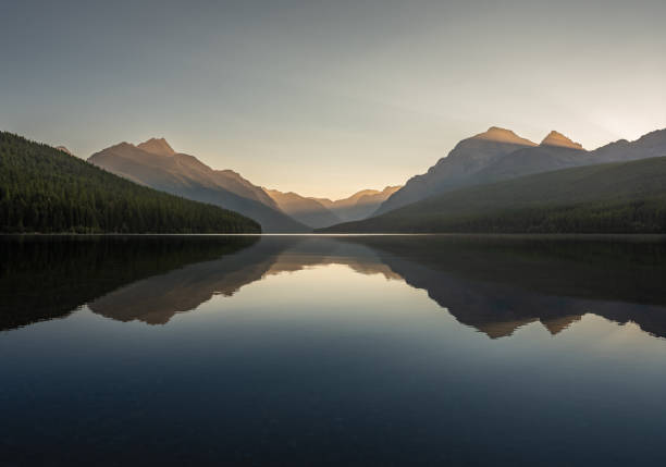 istock Golden Light Shines Through Mountains Behind Bowman Lake 2170372319