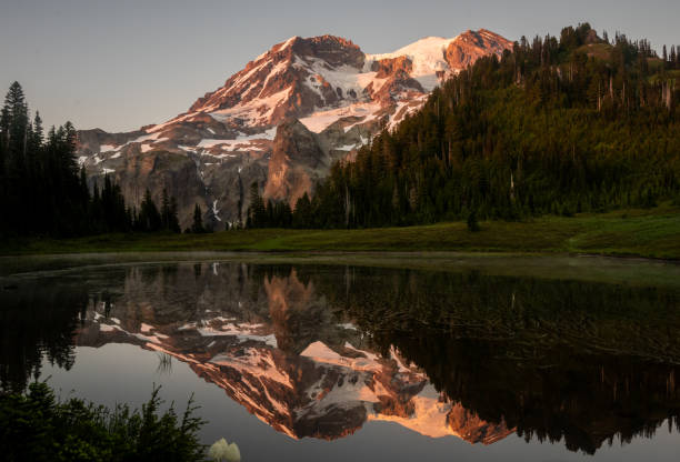 istock Pink Evening Light Hits Mount Rainier and Its Reflection in Aurora Lake 2170372633