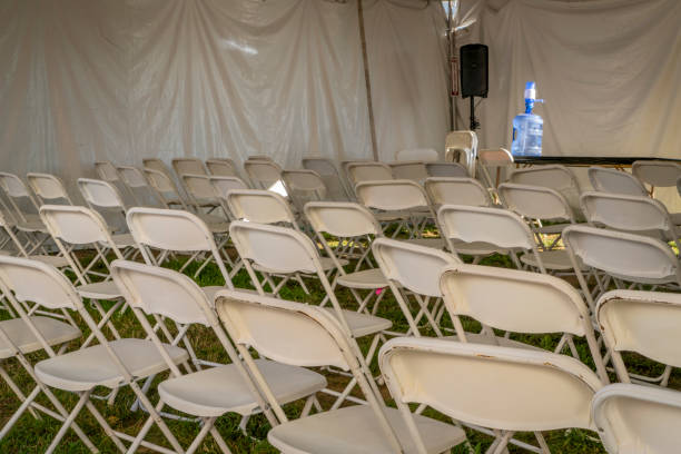 istock outdoor lecture room under a tent with metal folding chairs 2170375134