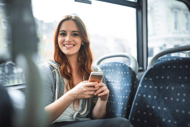istock woman using dating app on the bus 2170377446