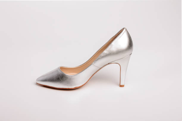 istock Elegant silver high heel shoe standing on white background 2170380065