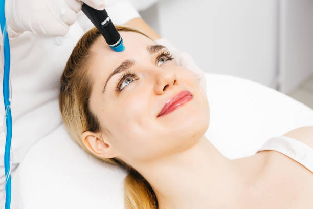 istock A professional cosmetologist performs hydropeeling and Hydradermabrasian on the client, providing advanced skin care procedures. Ideal for promoting luxury beauty services and enhancing your brand image. 2170384361