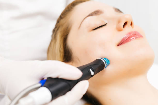 istock A professional cosmetologist performs hydropeeling and Hydradermabrasian on the client, providing advanced skin care procedures. Ideal for promoting luxury beauty services and enhancing your brand image. 2170384368