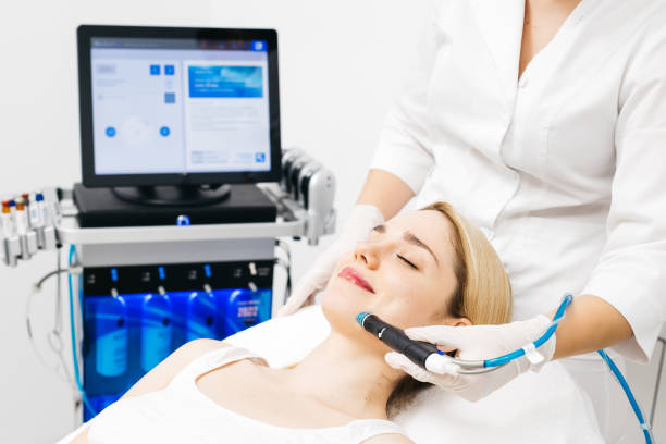 istock A professional cosmetologist performs hydropeeling and Hydradermabrasian on the client, providing advanced skin care procedures. Ideal for promoting luxury beauty services and enhancing your brand image. 2170384402