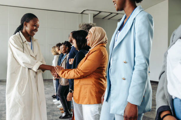 istock Black business woman shaking hands during a networking conference 2170384504
