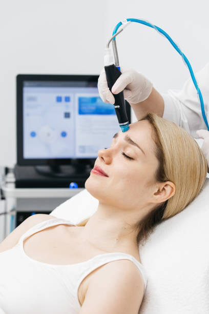 istock A professional cosmetologist performs hydropeeling and Hydradermabrasian on the client, providing advanced skin care procedures. Ideal for promoting luxury beauty services and enhancing your brand image. 2170384564