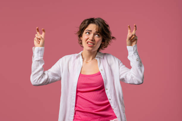 istock Sarcastic woman with hands two fingers air quotes gesture on pink, sarcasm 2170385656