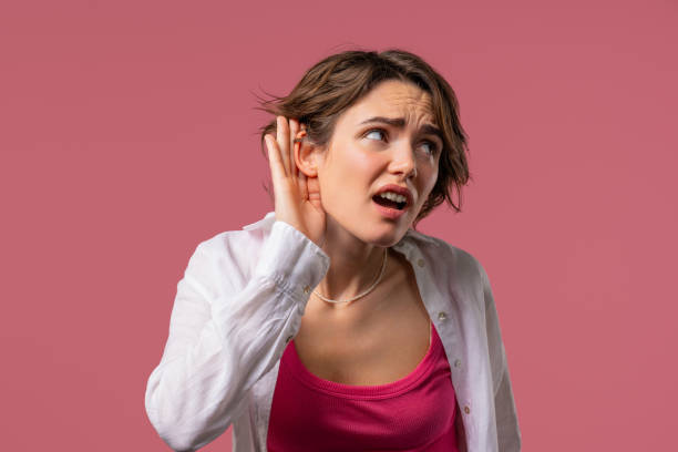 istock Curious woman doesn't hear, asking what. Quiet sound, deaf, misunderstand 2170385664