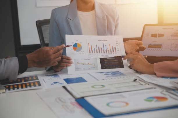 istock Close up of Business team analyzing income charts and graphs with modern laptop computer. Business analysis and strategy concept. 2170386007