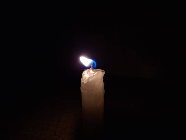 The candle : A candle in the night casts a soft, warm glow, creating a tranquil ambiance. Its flickering flame illuminates the darkness, adding a cozy, intimate touch to any evening setting.