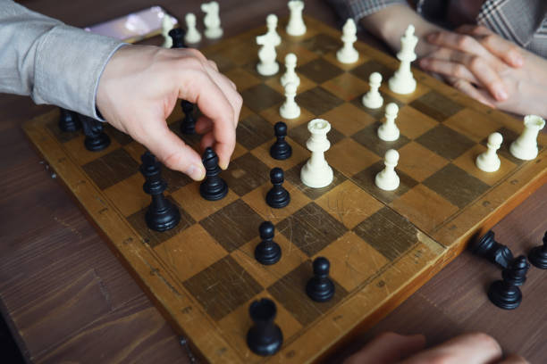istock Hand playing game of chess, competition, strategy, battle, play 2170395184