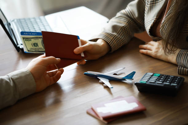 Travel agent receiving money from client for provided service