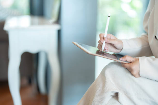istock The female executive efficiently managed her office tasks using her laptop, which was essential for coordinating business activities and ensuring smooth operational flow. 2170397426