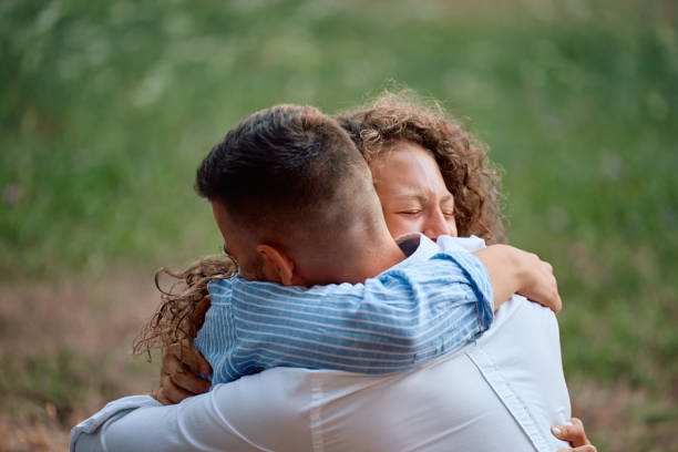 Affectionate couple in love embracing in nature.