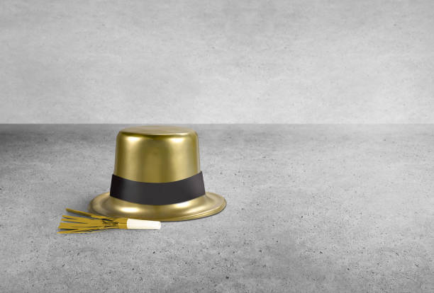 New Year's party hat and whistles on a concrete background