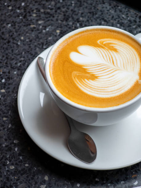 istock Hot coffee with latte art in white ceramic cup 2170400160