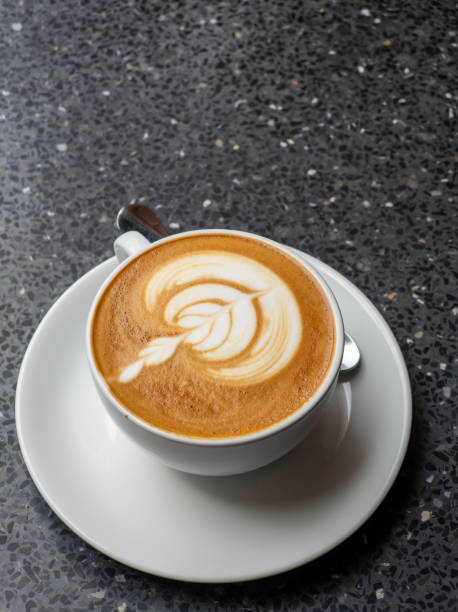 istock Hot coffee with latte art in white ceramic cup 2170400348