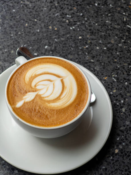 istock Hot coffee with latte art in white ceramic cup 2170400385