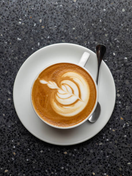 istock Hot coffee with latte art in white ceramic cup 2170400395