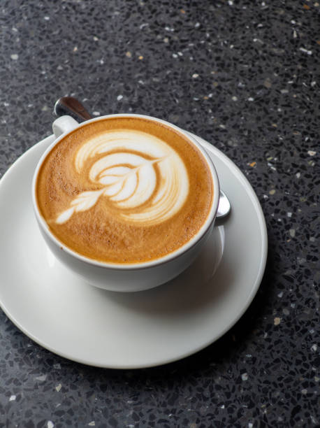 istock Hot coffee with latte art in white ceramic cup 2170400403