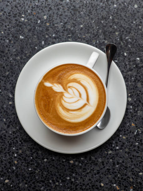 istock Hot coffee with latte art in white ceramic cup 2170400405