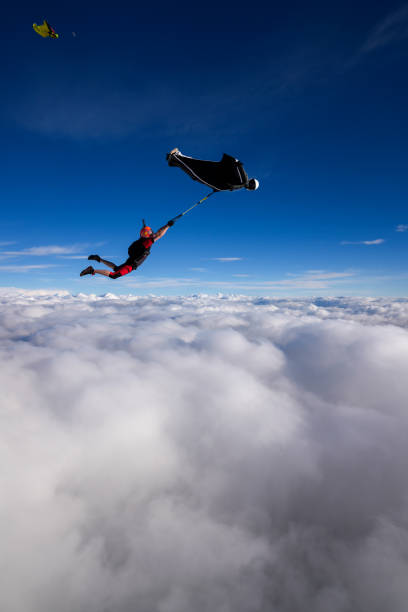istock Wingsuit trapeze jump in mid air 2170401377