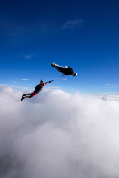 istock Wingsuit trapeze jump in mid air 2170401463