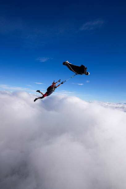 istock Wingsuit trapeze jump in mid air 2170401464