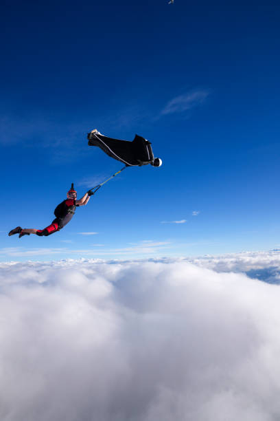 istock Wingsuit trapeze jump in mid air 2170401465