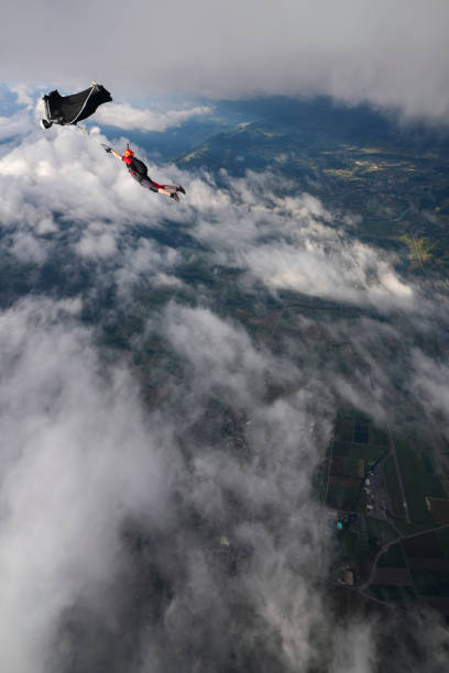 istock Wingsuit trapeze jump in mid air 2170401608