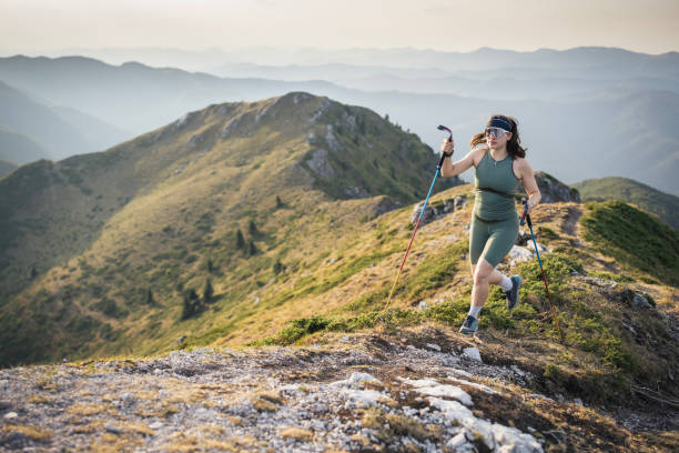 istock Woman running on mountain trail, trail running. 2170402439